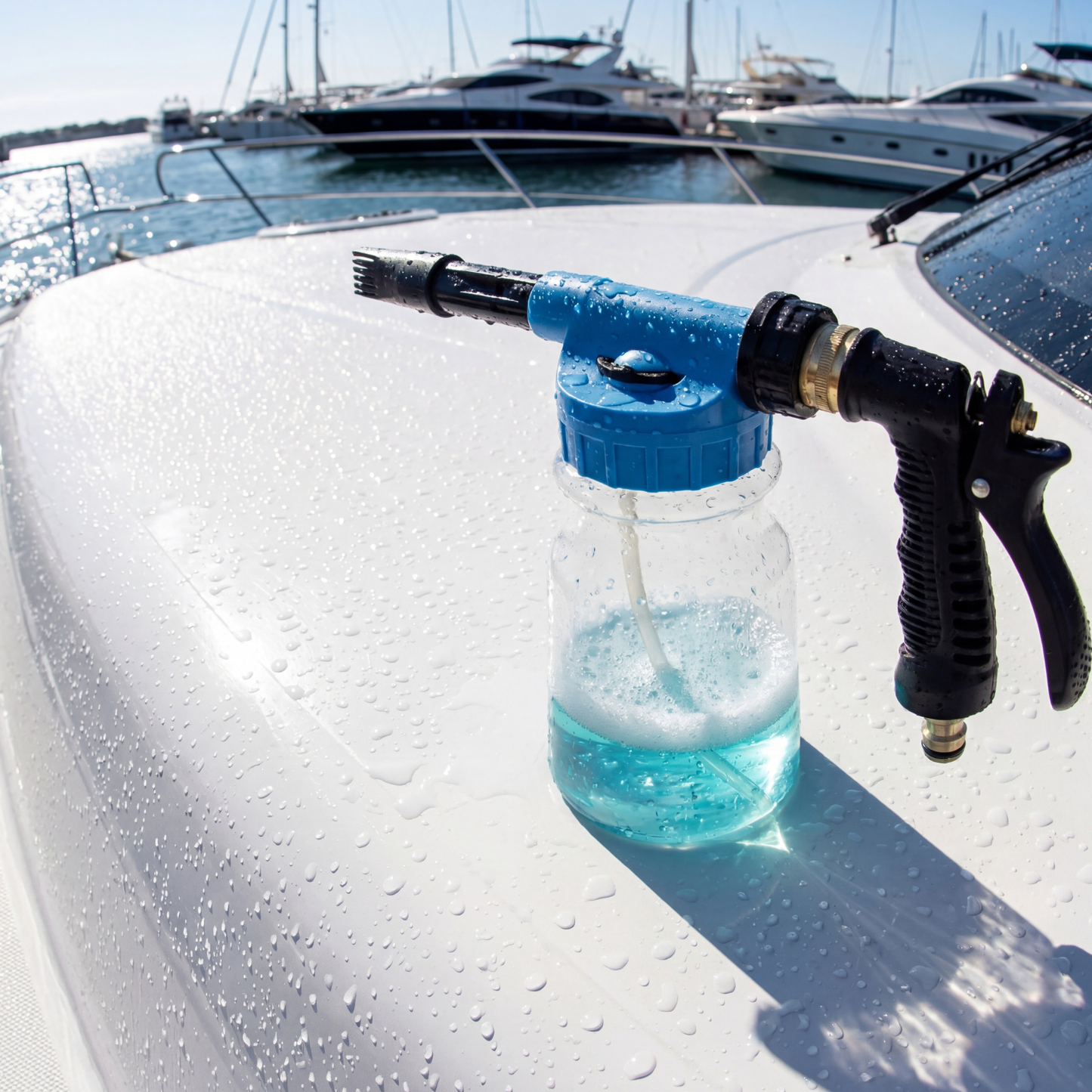 Boat foam cannon spraying thick foam from garden hose onto boat deck during cleaning
