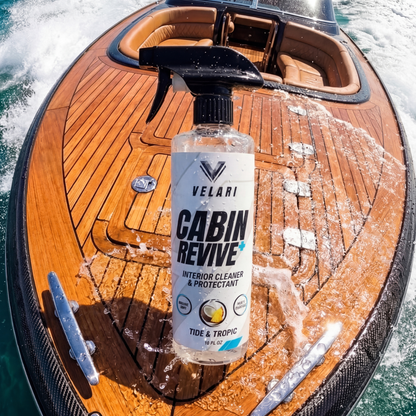 velari interior cleaner bottle sitting on teak boat deck marina setting