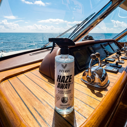 velari marine glass cleaner bottle on teak boat deck near helm